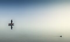 rule of thirds photography of man on boat