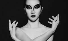 topless woman with silver crown