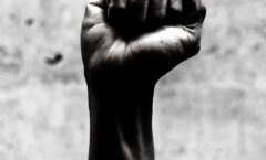 person's right fist grayscale photography